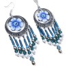 Boucles d'oreilles bohème pendantes avec fleurs bleues en pâte polymère