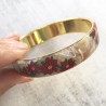 Bracelet poinsettias noel, fond nacre et or, en pâte polymère