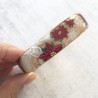 Bracelet poinsettias noel, fond nacre et or, en pâte polymère