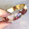Bracelet poinsettias noel, fond nacre et or, en pâte polymère